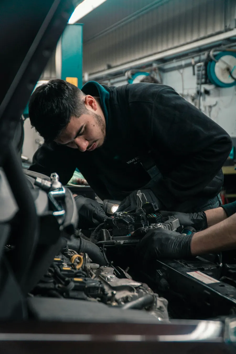 A mechanic checking a car